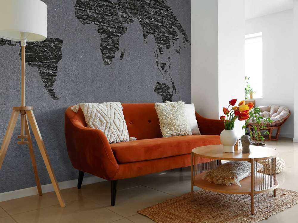 Pietre della mappa del mondo su cemento grigio