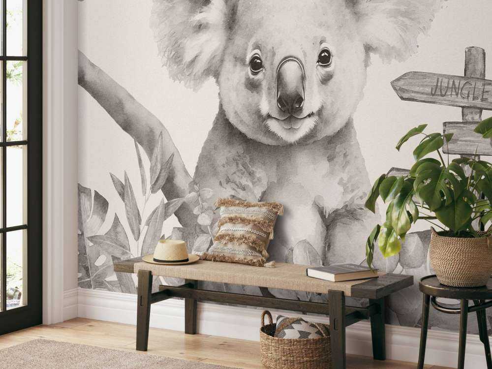 Baby koala nella giungla beige