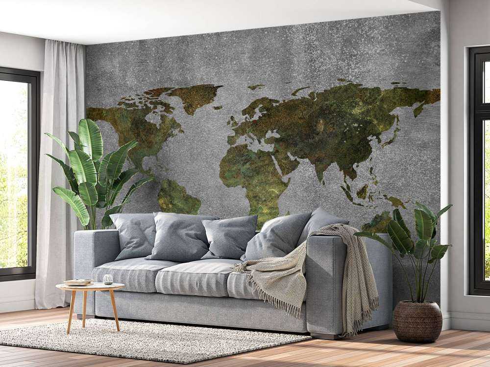 Mappa del mondo con struttura verde su cemento grigio