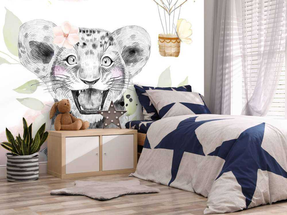 Cucciolo di leone allegro e palloncino