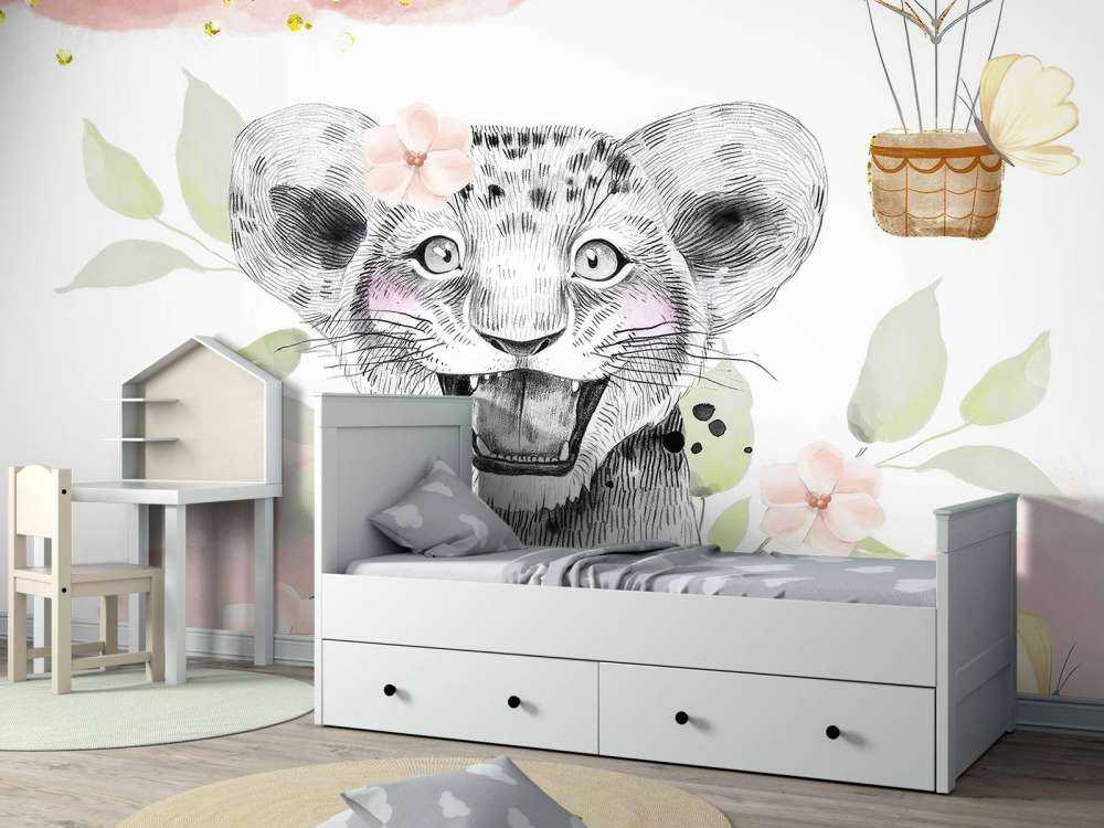 Cucciolo di leone allegro e palloncino