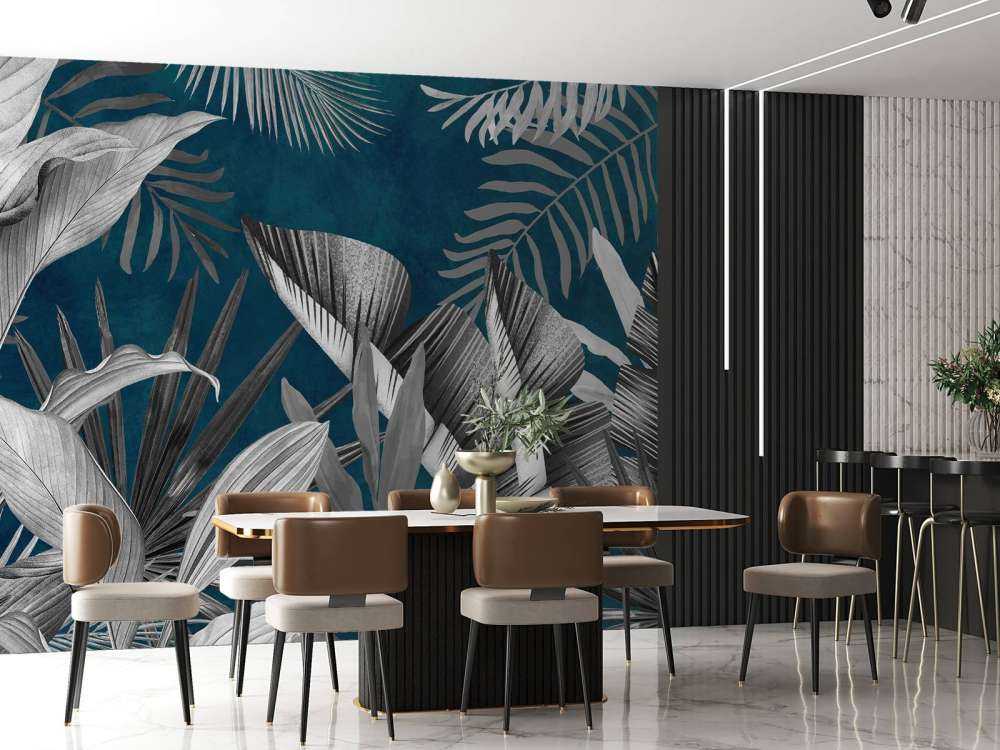 Foglie tropicali su sfondo blu