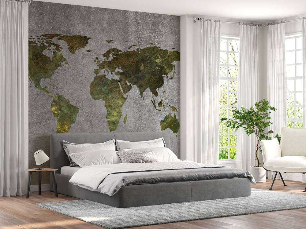 Mappa del mondo con struttura verde su cemento grigio