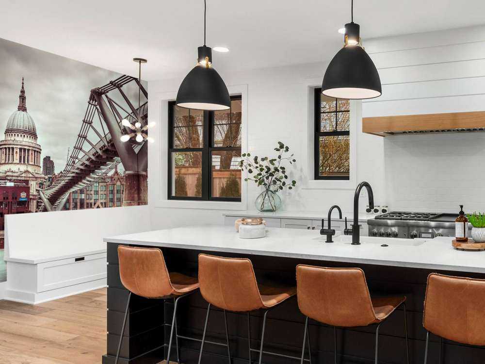 View of St Paul's Cathedral and Millennium Bridge from river thames, London, UK