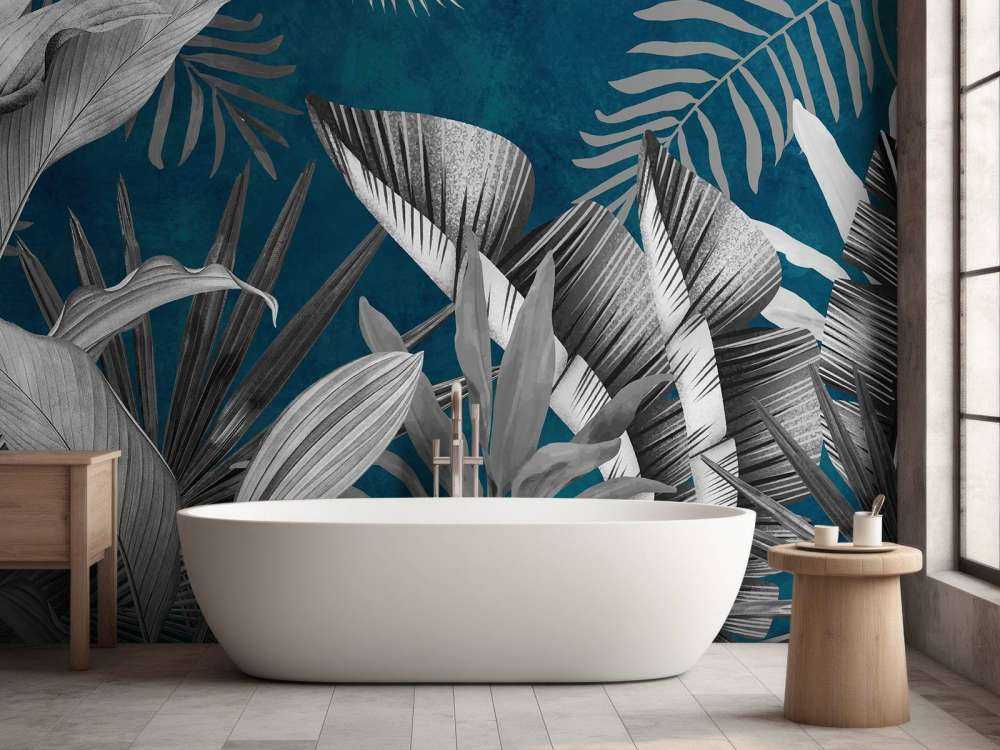 Foglie tropicali su sfondo blu