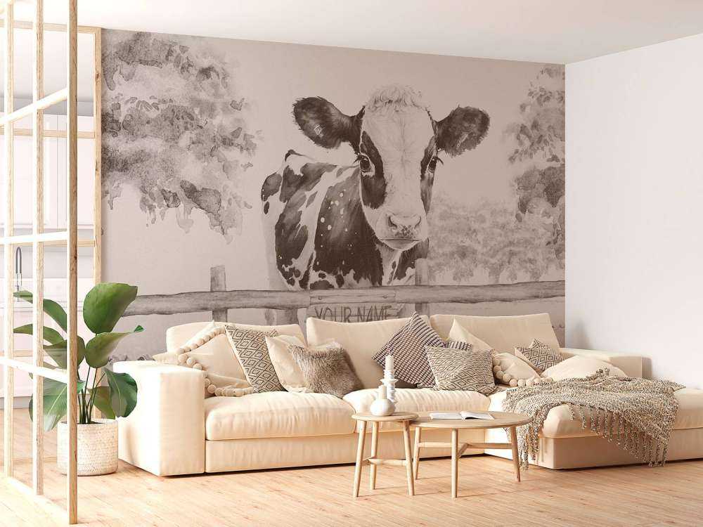 Baby mucca in un prato beige