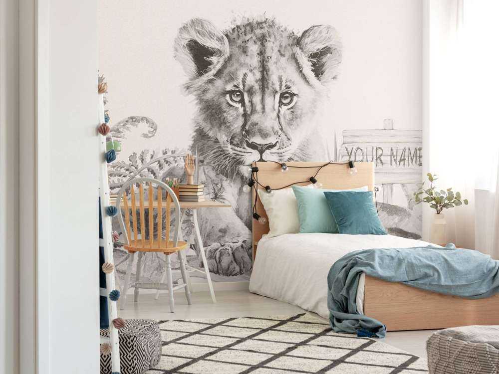 Baby leone nella giungla beige