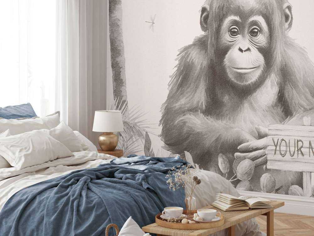 Cucciolo di orango nella giungla beige