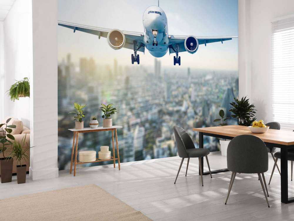 Aereo in discesa sopra una città