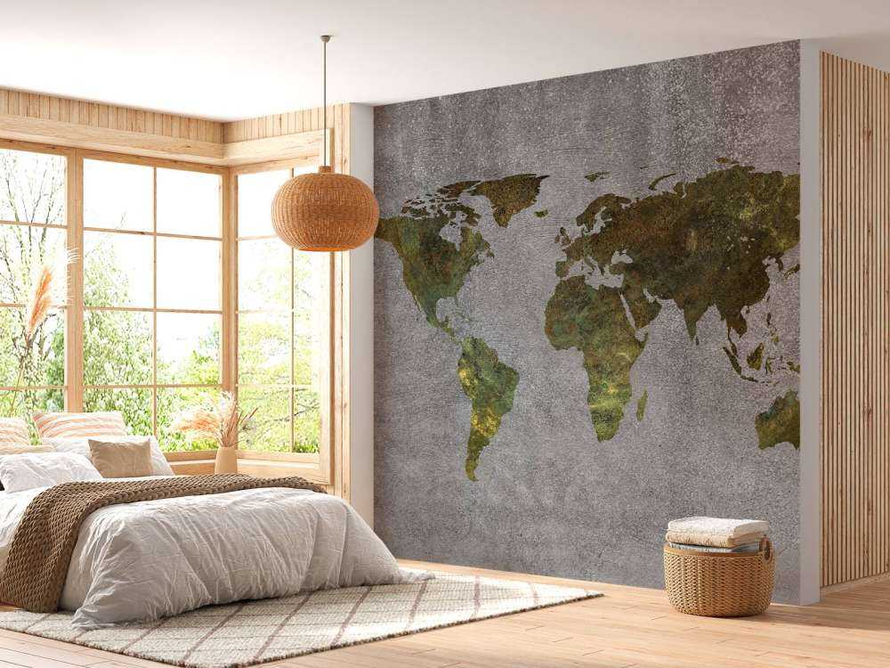 Mappa del mondo con struttura verde su cemento grigio