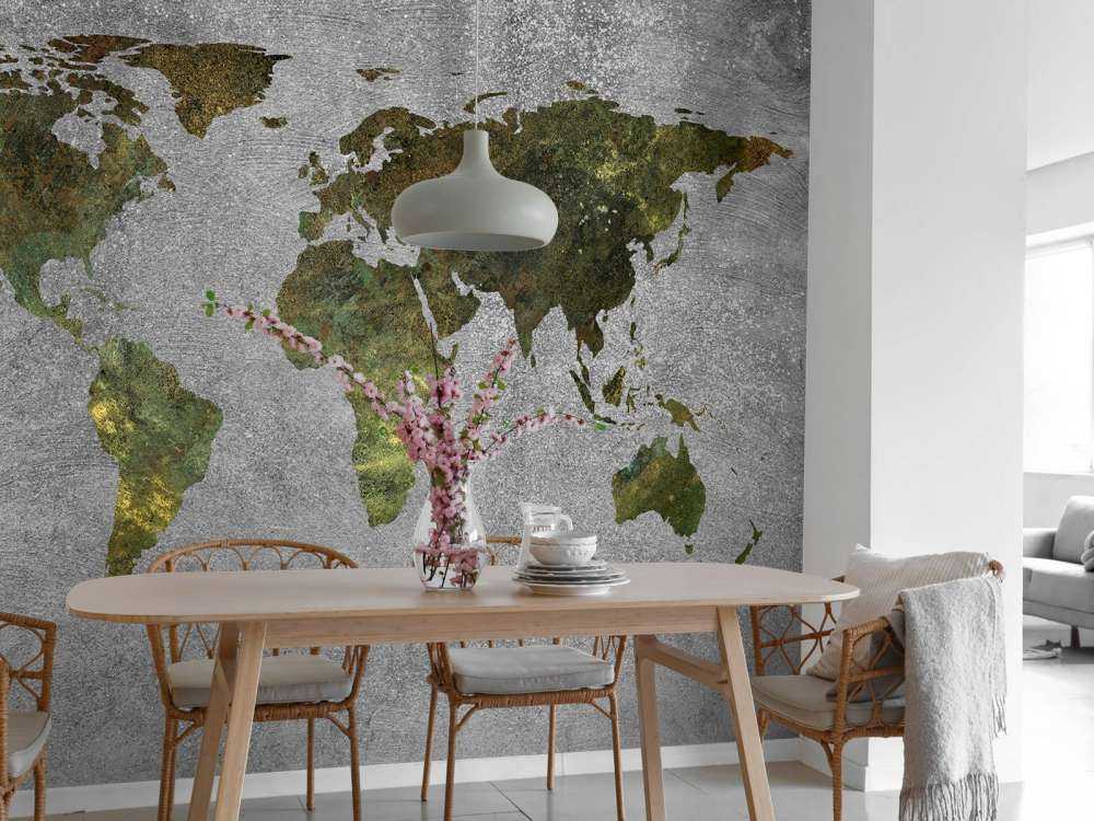 Mappa del mondo con struttura verde su cemento grigio