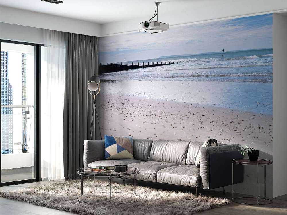 HAPPY message written in smooth sand at the beach