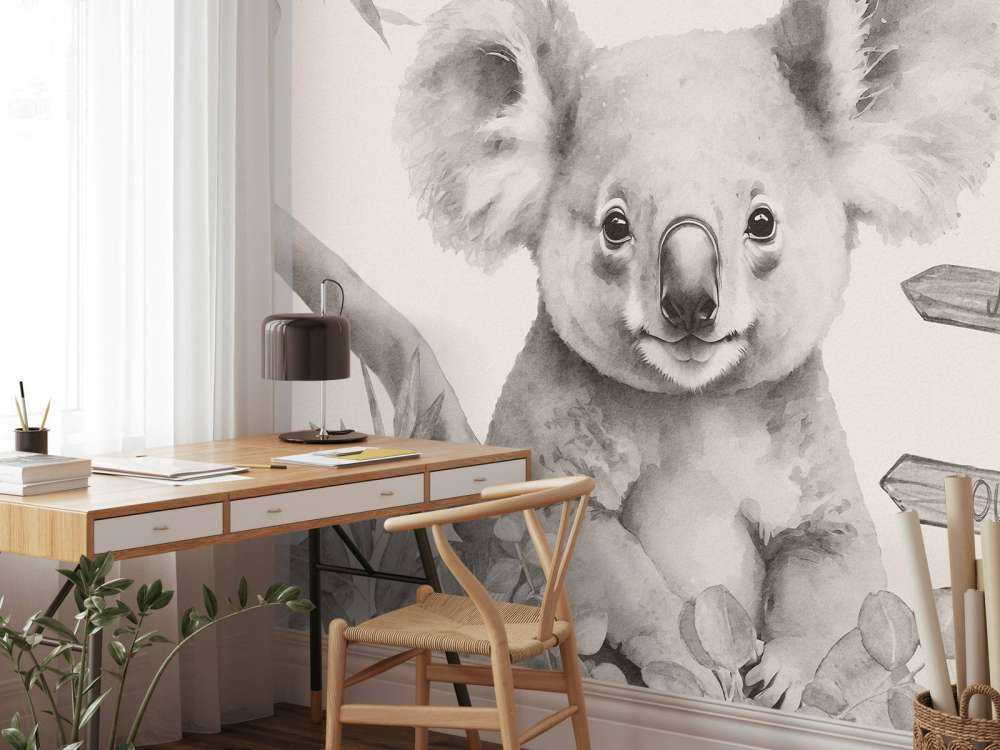 Baby koala nella giungla beige