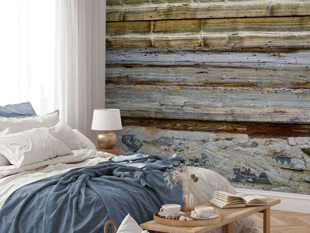 Legno invecchiato su muro di pietra