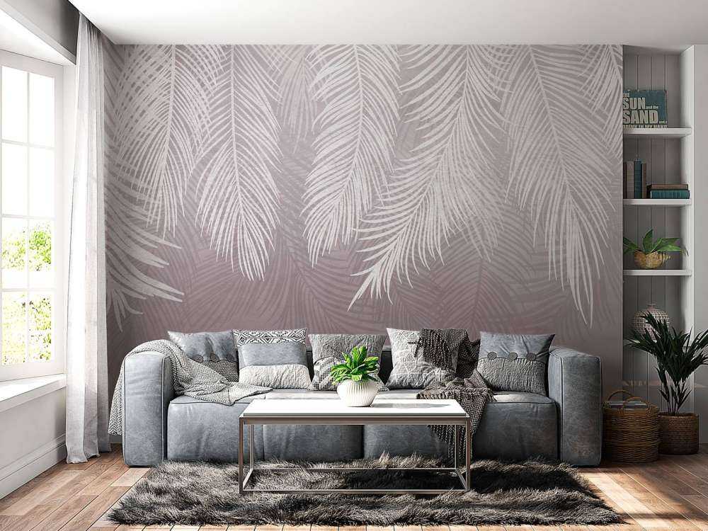 Hojas de palmera sobre hormigón